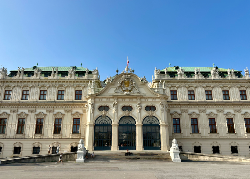 Large white palace building with grand steps in front