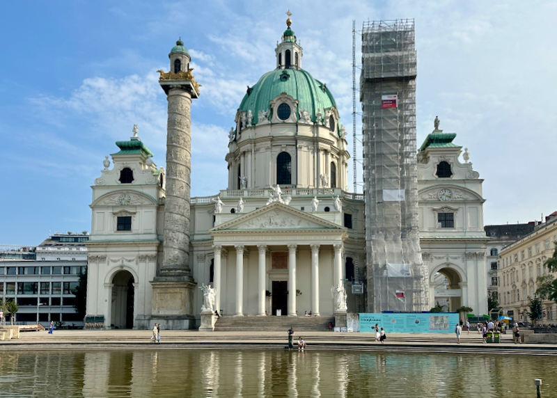 View across a reflecting pool of St Charles Church in Vienna