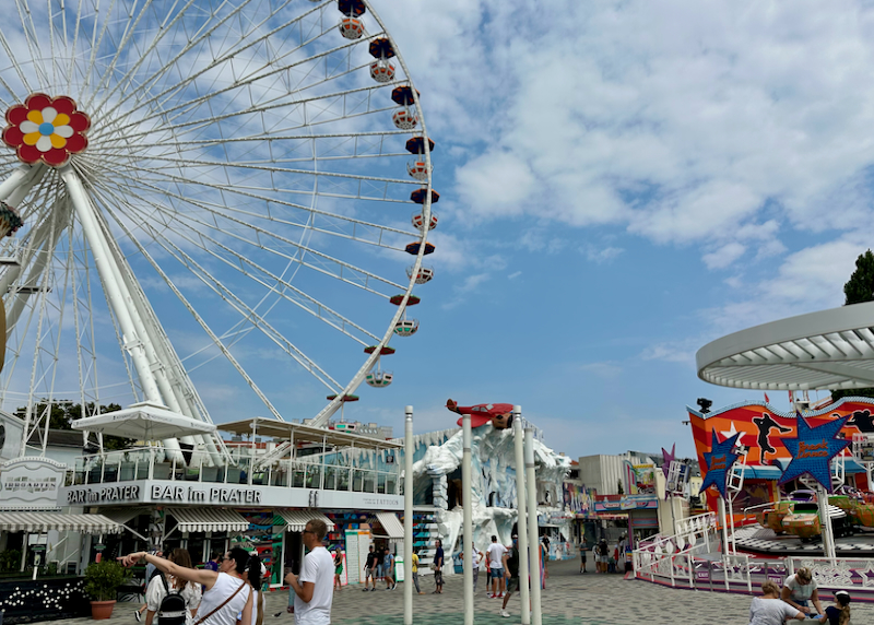 Colorful amusement park with a large ferris wheel 