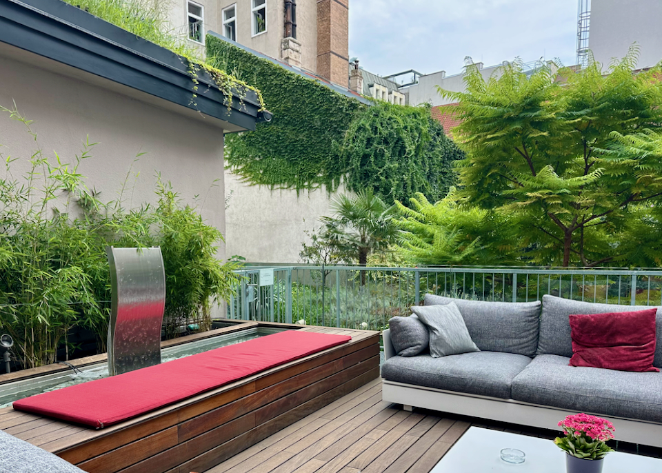 Outdoor decking space surrounded by plants
