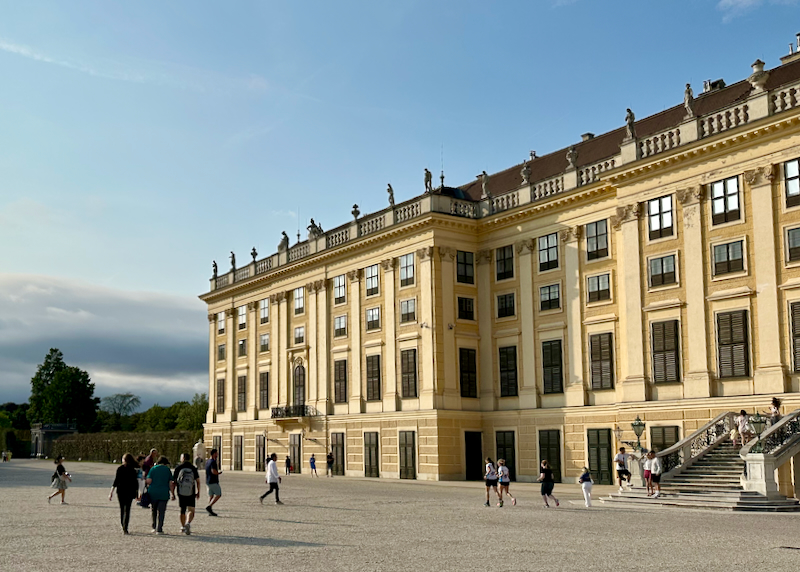 Tourists take photos outside Schonbrunn Palace in Vienna