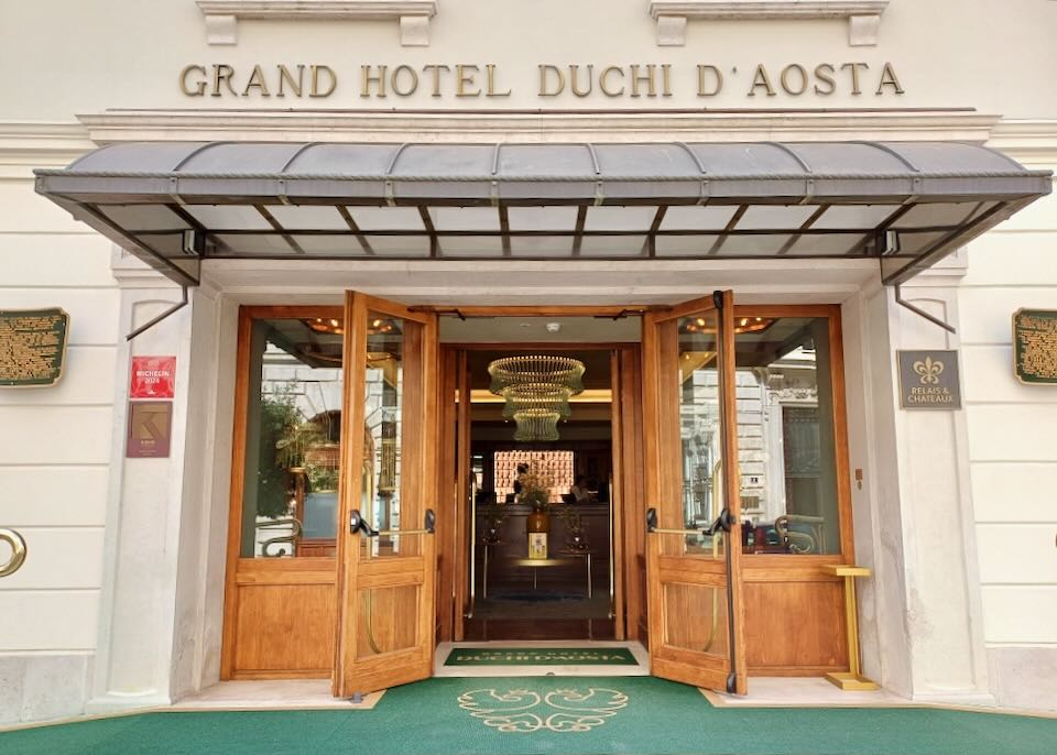 Wood doors open to a hotel.