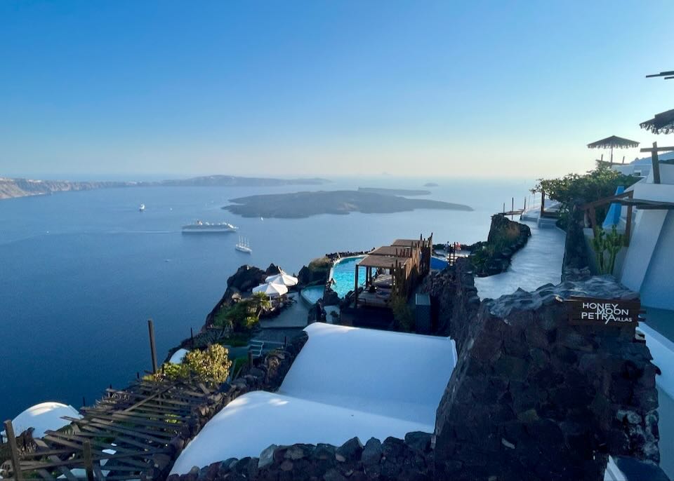 Imerovigli hotel with volcano and caldera views.