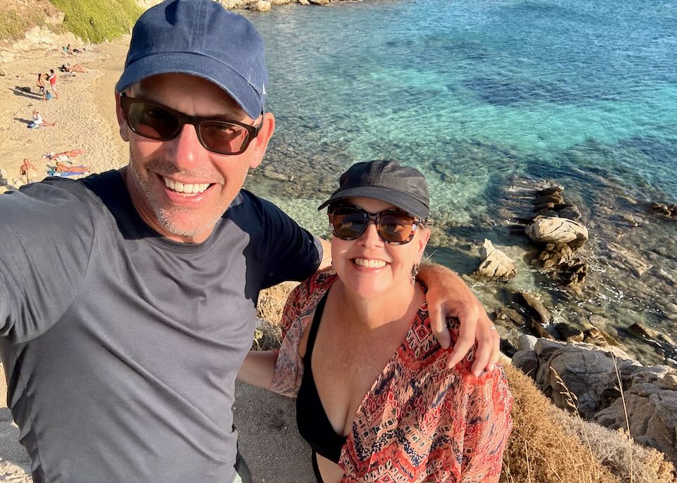 Me and my wife on a beach walk in Mykonos.