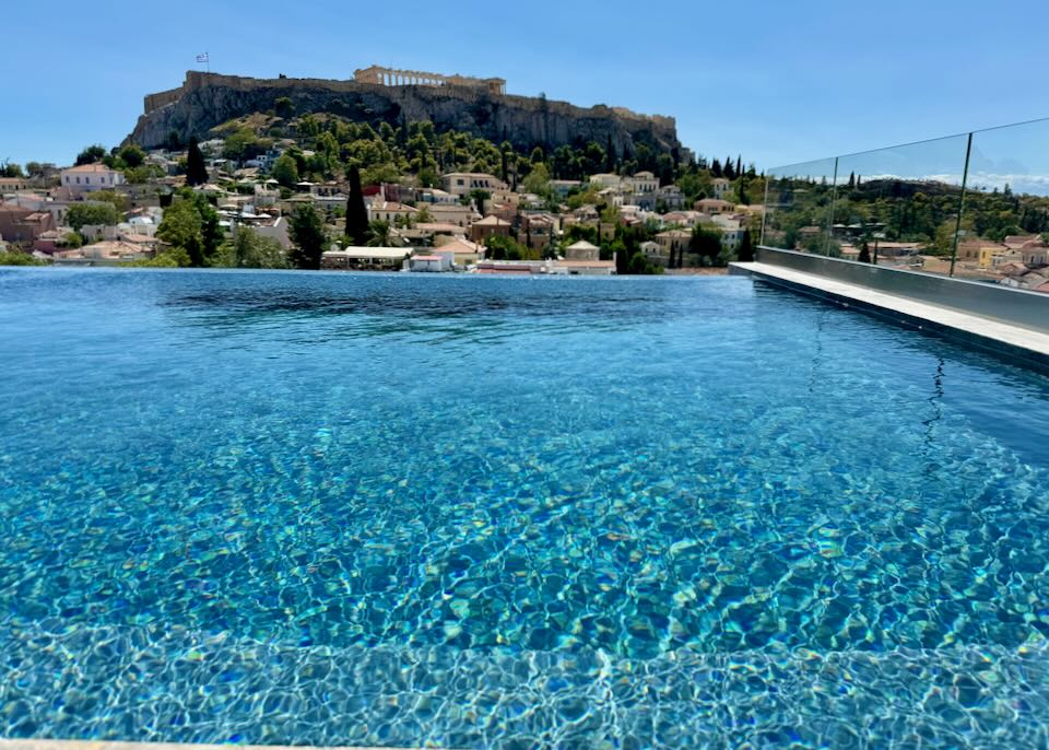 Hotel with rooftop pool and view of the Acropolis in Athens.