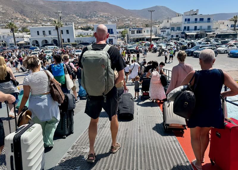 Me wearing a backpack as I exit the ferry.