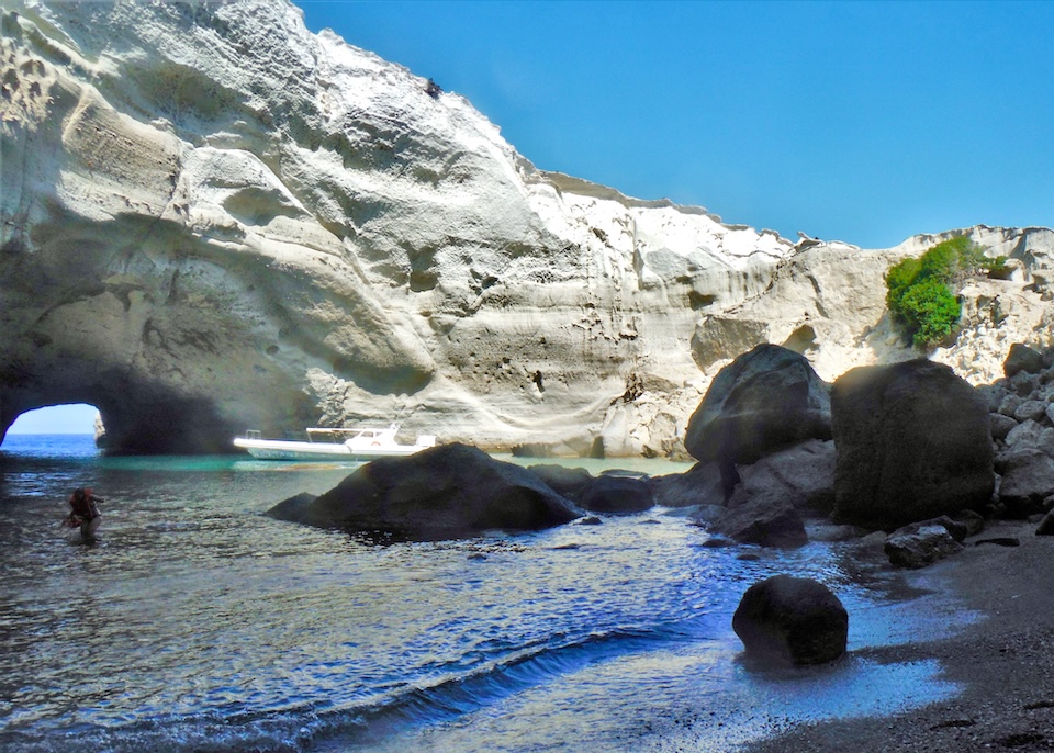 A beach accessible behind a rock archway in Kleftiko, Milos.