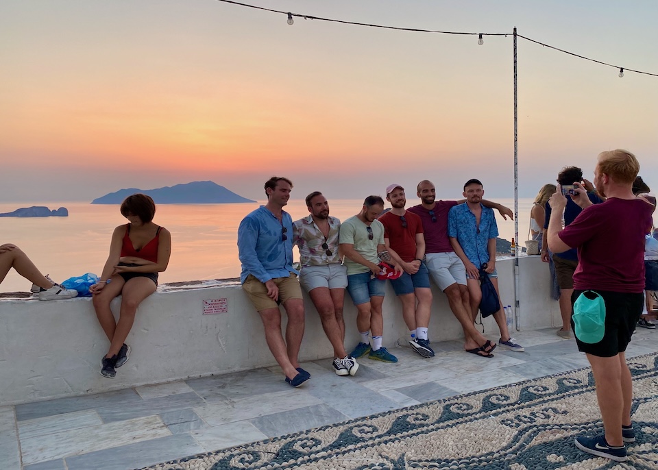 Tourists gathering for sunset photos in Plaka, Milos.