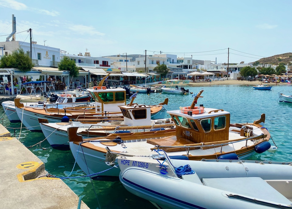 Small boats tied to the pier in Pollonia, Milos.