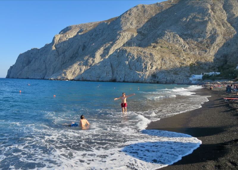 My sons playing on Kamari Beach.