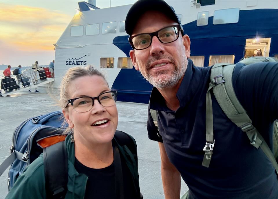 My wife and I at the Santorini ferry port.