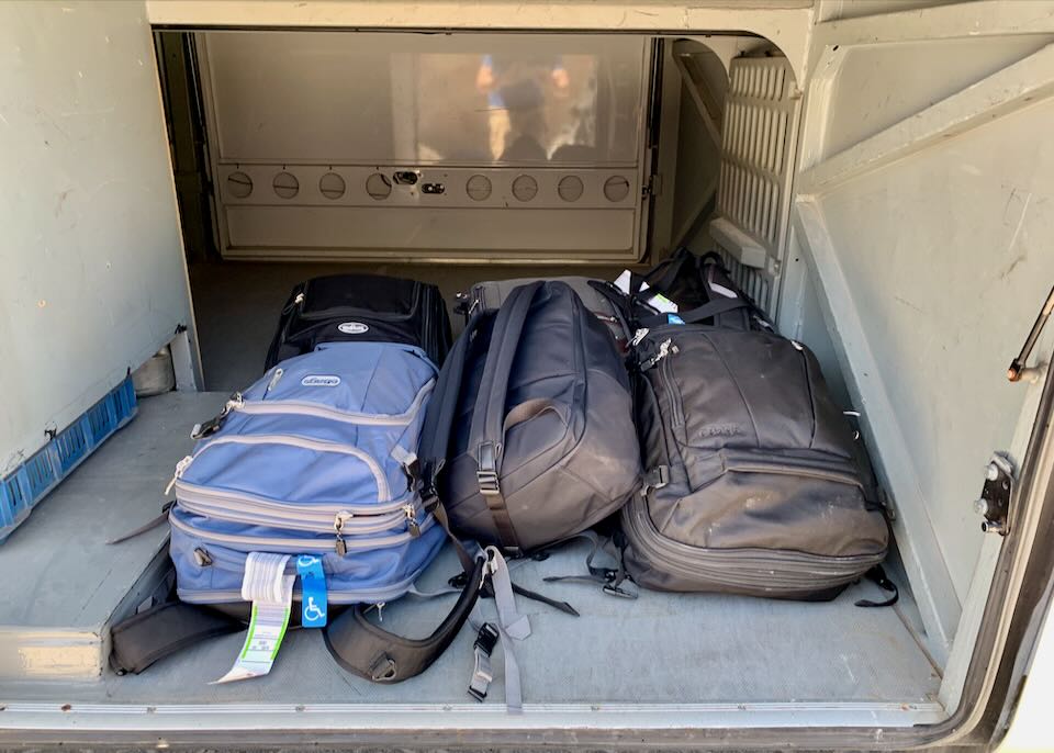 Luggage under a Mykonos bus.