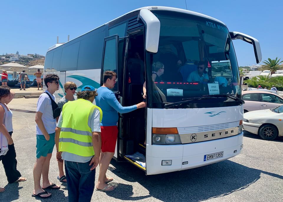 My wife and sons boarding a bus in Ornos.