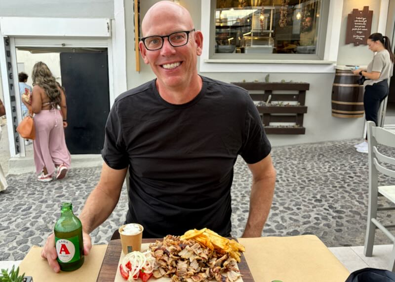 Santorini Dave eating gyro in Oia.
