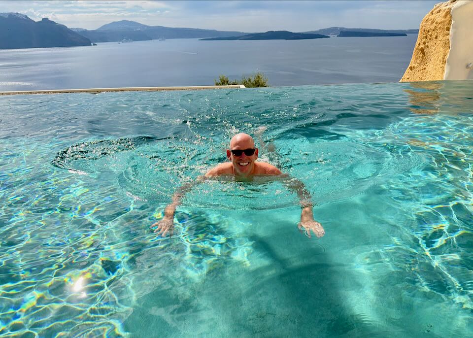 Santorini Dave swimming in Oia hotel pool.