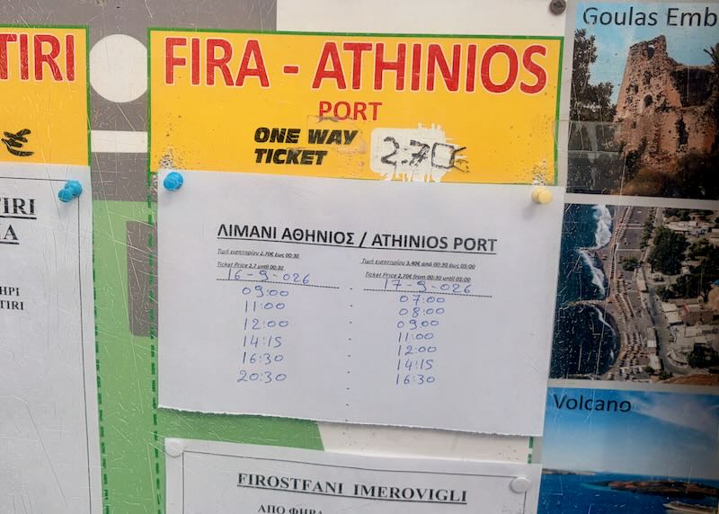 Bus schedule at the Fira bus station for Athinios Ferry Port.
