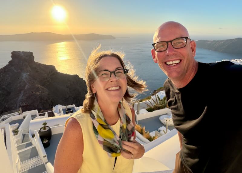 Santorini Dave and his wife during a sunset in Santorini.